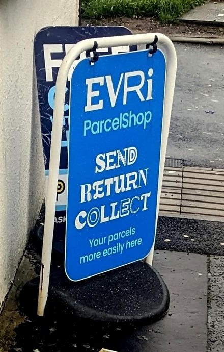An EVRi ParcelShop A-board sign outside a shop