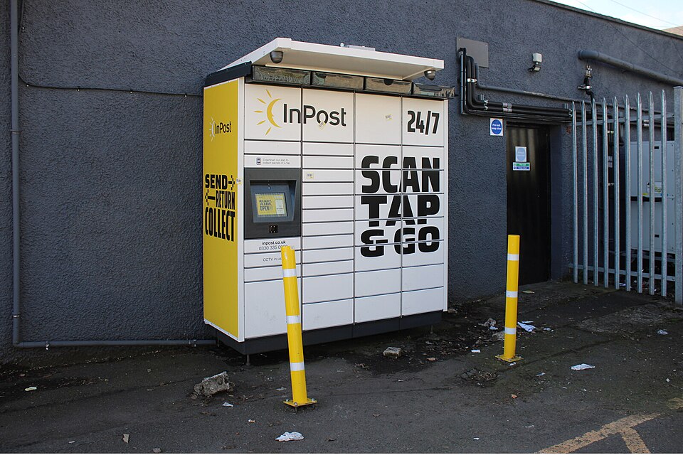 A row of yellow InPost parcel lockers