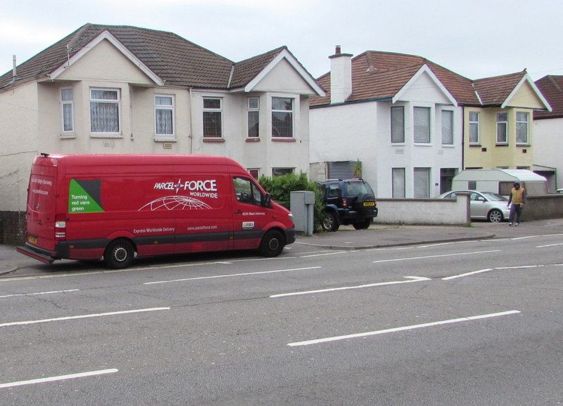 A red Parcelforce Worldwide delivery van